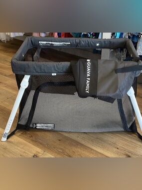 Guava lotus travel crib with green sun shade